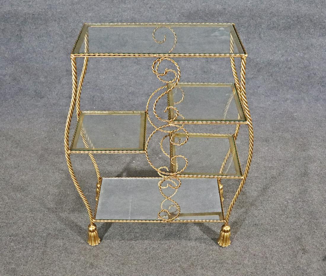 NAPOLEONIC STYLE ETAGERE: Bottom shelf mirrored. 5 shelves. Gilt. Rope twist. 32" h x 24 1/2" w x 11 1/2" d.