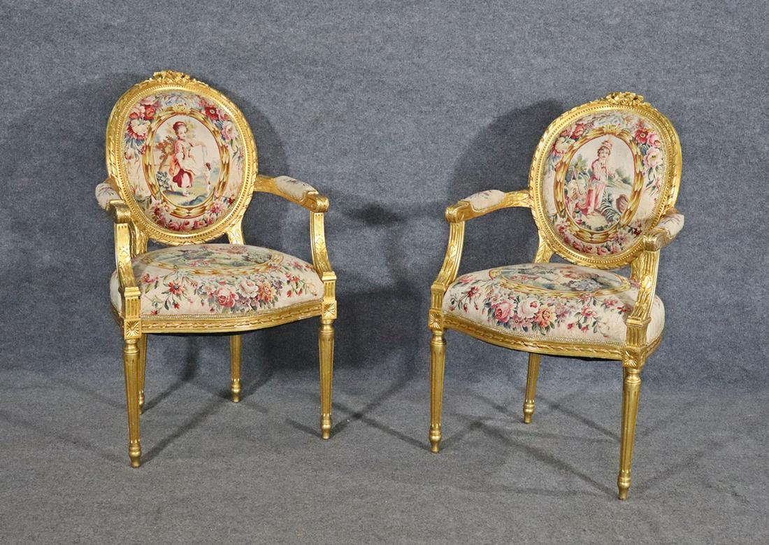 PAIR FRENCH GILT AUBUSSON STYLE FAUTEUILS: Carved gilt frame and legs. Aubusson style upholstery. Floral detail. 39 1/4" h x 24" w x 26" d. Seat height 19 1/2".
