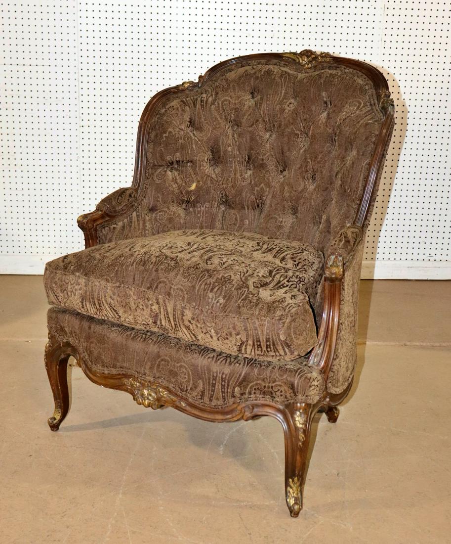 FRENCH TUFTED BACK BERGERE: Carved wood. Gilt accents. 40 1/2" h x 31 1/4" w x 31 1/2" d x 22 1/4" seat height.