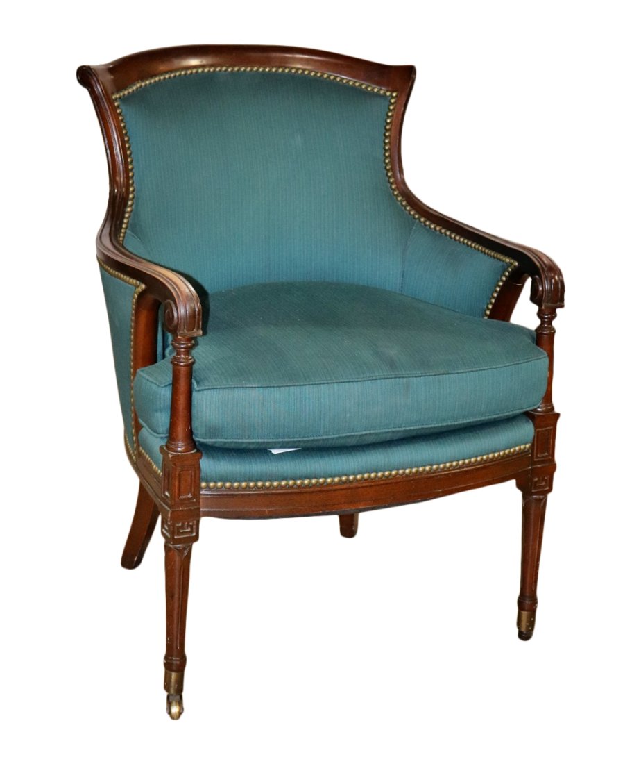HENREDON UPHOLSTERED ARM CHAIR: Henredon. Upholstered. Nailhead trim. Carved wood. Front legs on castors. 34 1/2" h x 25 5/8" w x 26 3/4" d x 20 1/2" seat height.