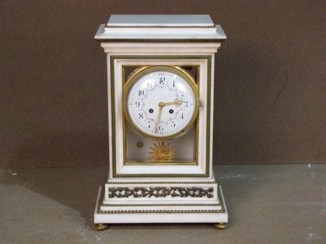 FRENCH BRONZE MOUNTED MARBLE CLOCK: Movement marked Black, Starr & Frost. Fair condition. Missing bronze mount on side of clock. Damage to marble on back corner. 19"h. x 12 1/4"w. x 7 1/4"d.