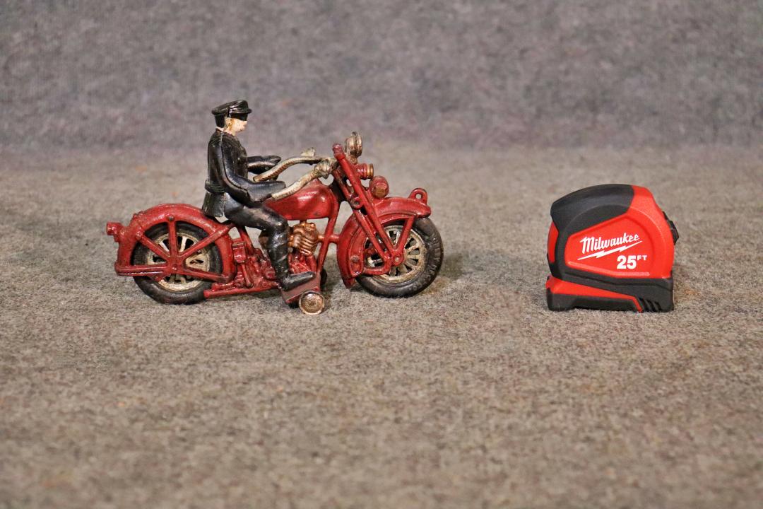 VINTAGE TOY: Vintage. Tire says "Hubley". 5 1/4" h x 8 3/4" w x 3 1/2" d.