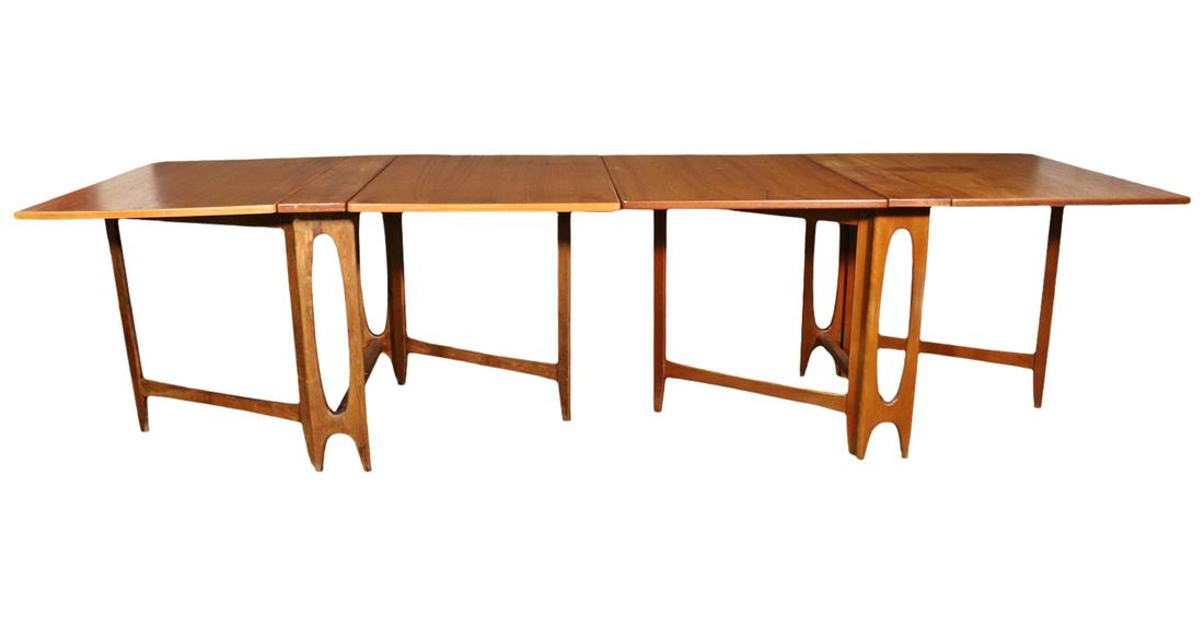 2 PC TEAK DROP LEAF DINING TABLE IN THE STYLE OF BRUNO MATHSSON: Teak. Drop leaf. Attributed to Bruno Mathsson. Fully expanded measures 25 5/8" h x 113" w x 35 3/8" d. Closed measures 29" h x 16 1/4" w x 35 1/4" d.