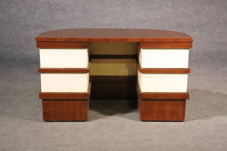 DESK ATTRIBUTED TO PAUL FRANKL: 2 tone mahogany with parchment sections. 3 drawers on each side. 29" h x 50" w x 24" d.