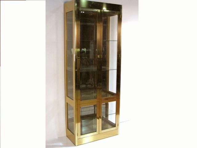 MASTERCRAFT BRASS CURIO CABINET: Very good condition. 84"h. x 31 5/8"w. x 15 3/4"d.