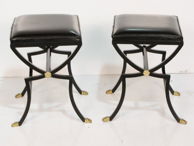 Pr. REGENCY STYLE BLACK IRON STOOLS: Marks on vinyl upholstery. Brass rosettes and claw feet. Very good condition. 19 3/4"h.x 16"w. x 18"d.