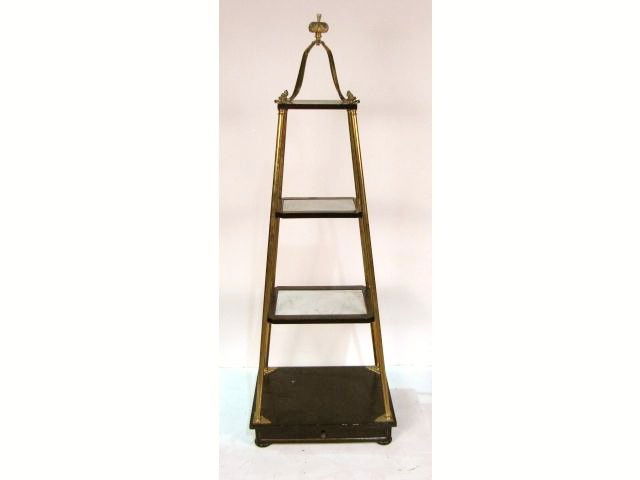 OBELISK FORM BRASS & WOOD ETAGERE: Marble inserts. Ebonized wood with wear. Good condition. 66"h. x 23 1/4"w. x 18"d.