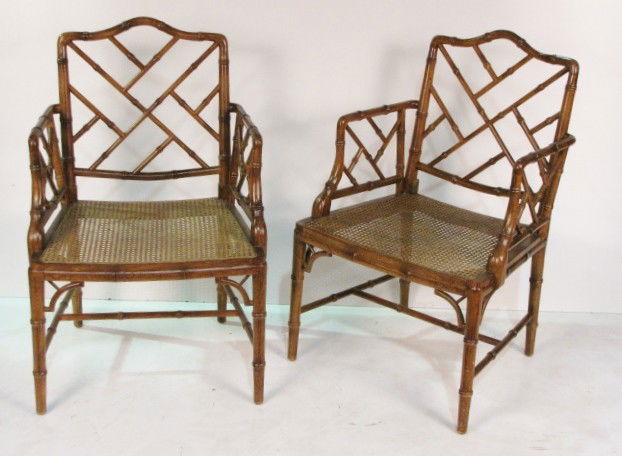 Pr. FAUX BAMBOO ARM CHAIRS: Caned seats. Very good condition. 36"h. x 23"w. x 23"d.