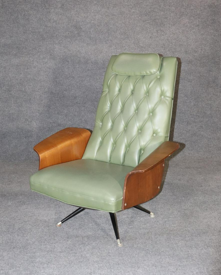 DANISH BENTWOOD SWIVEL/ROCKING CHAIR: Teak. Vinyl upholstery. Tufted back. Swivels. Rocks. Metal legs. 39 3/4" h x 32 3/8" w x 34 1/2" d. Seat height 16".