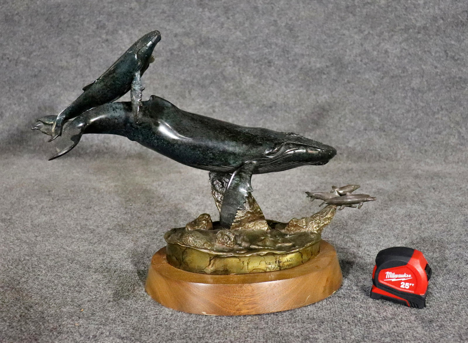 RANDY PUCKETT BRONZE SCULPTURE FEMALE HUMPBACK WHALE & HER CALF: Numbered 74/350. Dated 1994. Wood base. Bronze. Painted. Swivels. 15" h x 20 3/4" w x 11 3/4" d.