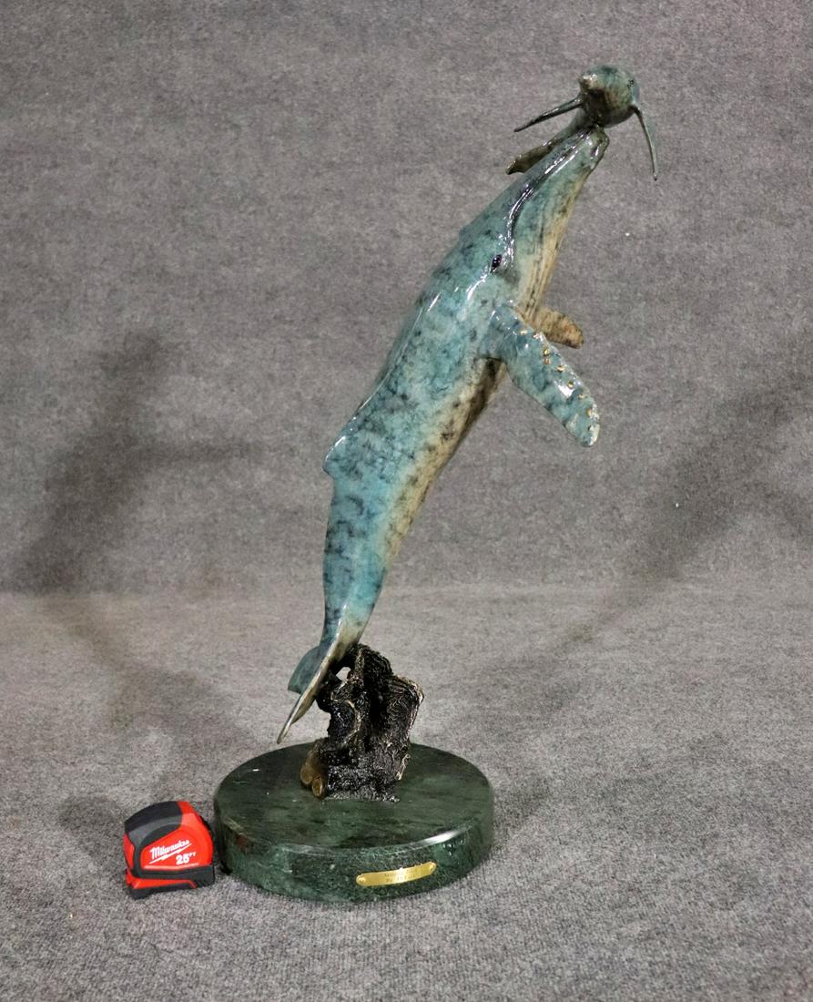DELIER NURTURING TOUCH BRONZE SCULPTURE WHALE: Signed. Name plate on base. American bronze foundry. Fine art. Hubbs SeaWorld research institute. Numbered 153/199. Marble base. Painted. Bronze. Swivels. 28" h x 19 1/2" w x 17 1/2" d.