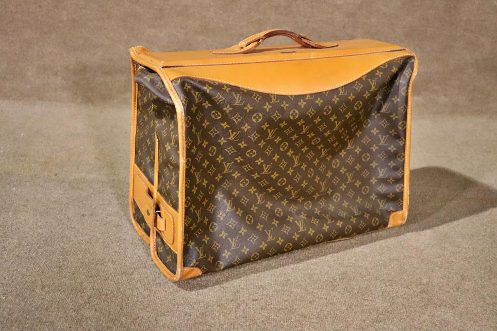 LOUIS VUITTON VALET BAG: Fabric. Leather. Louis Vuitton. Paris France. Manufactured by The French Co., USA under special license. 17" h x 23 1/2" w x 12" d.
