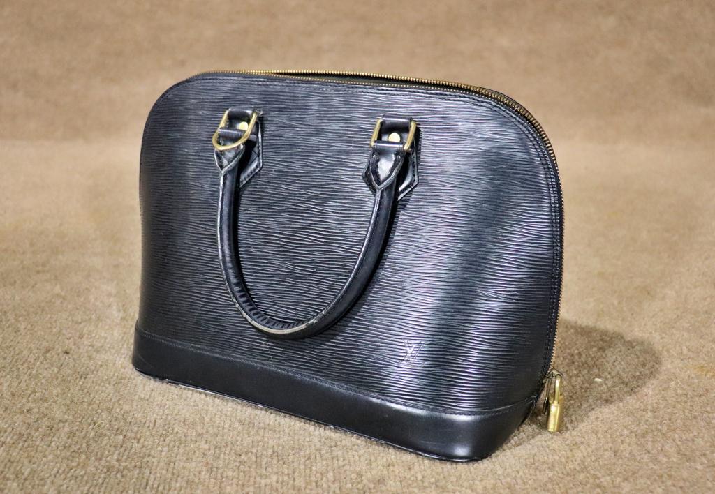 LOUIS VUITTON HANDBAG: Leather. Louis Vuitton. Paris. Made in France. 9 1/2" h x 12" w x 6" d.