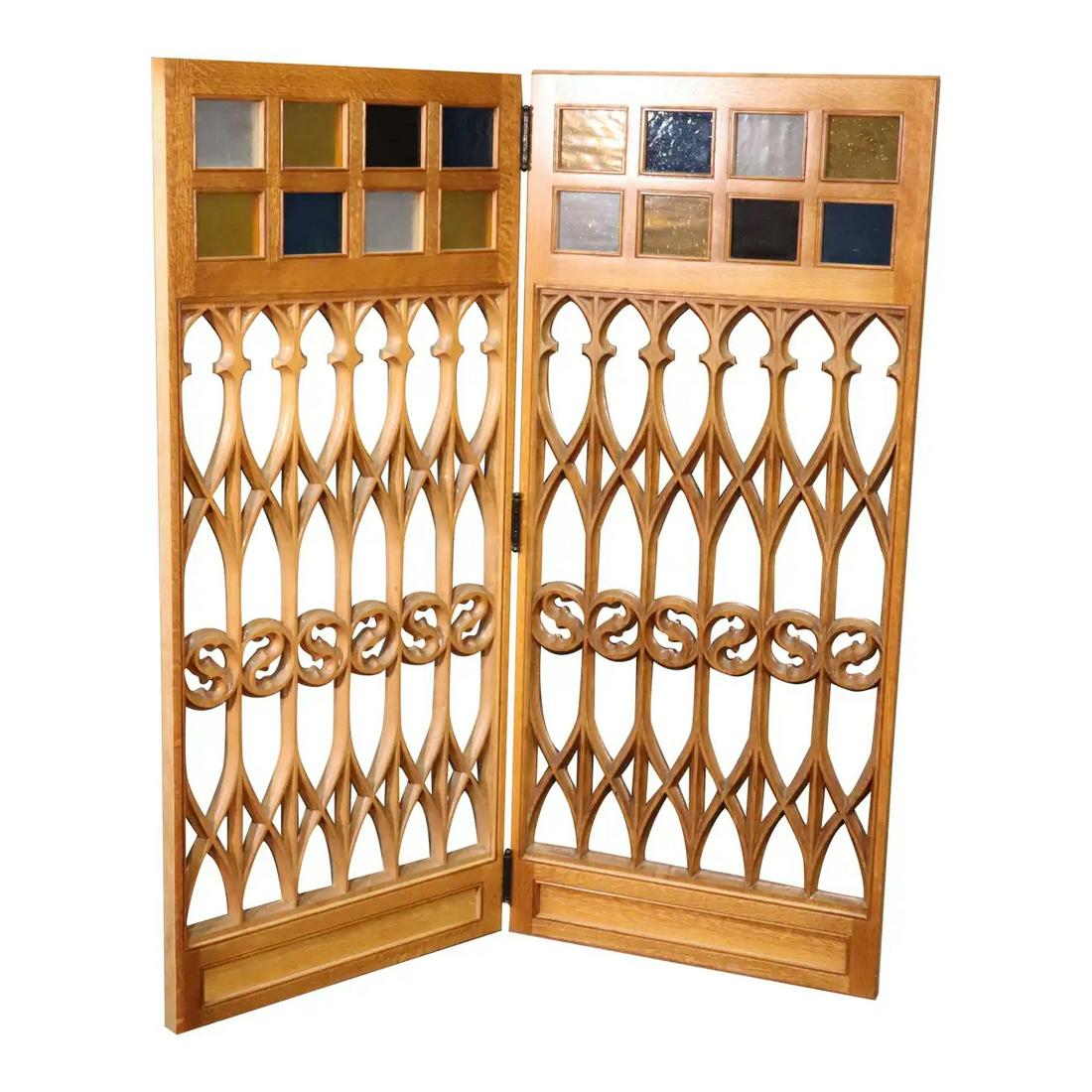 1 OF 12 STAINED GLASS OAK GOTHIC PANELS/DOORS: This is listed as a set, meaning two panels with hinges. One of six pairs. Solid oak. Seeded stained glass. 62" h x 27" w x 1 1/2" d.