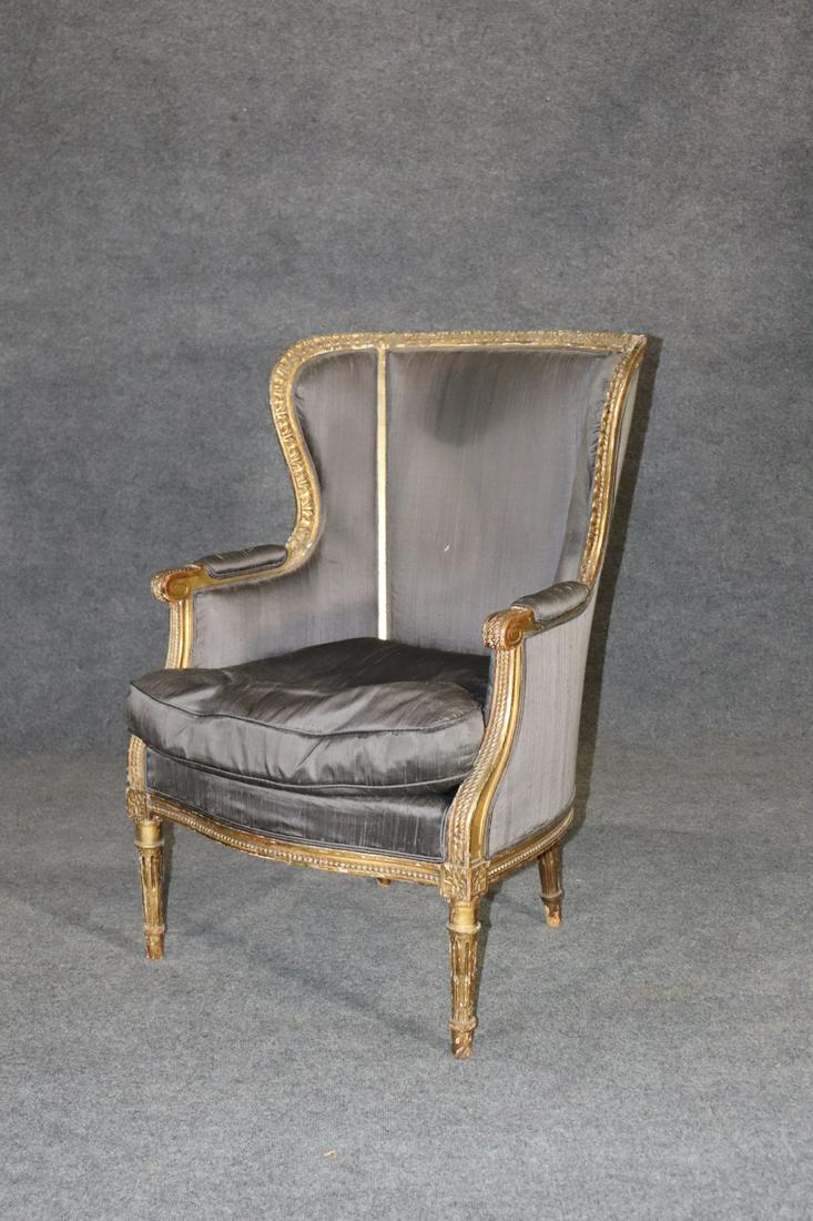 LOUIS XVI STYLE BERGERE: Carved gilt frame. Upholstered. 40 1/2" h x 25 1/2" w x 30" d. Seat height 18"