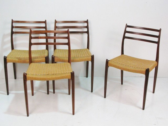 4 J.M. MOLLER ROSEWOOD CHAIRS: Woven seats. Excellent condition. 31 3/4"h. x 19 1/4"w. x 21"d.