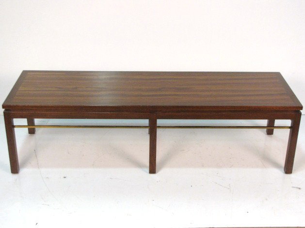 EDWARD WORMLEY DUNBAR ASIAN MODERN COFFEE TABLE: Model 313. Mahogany and brass. Very good condition with light wear. 15"h. x 56"w. x 18"d.