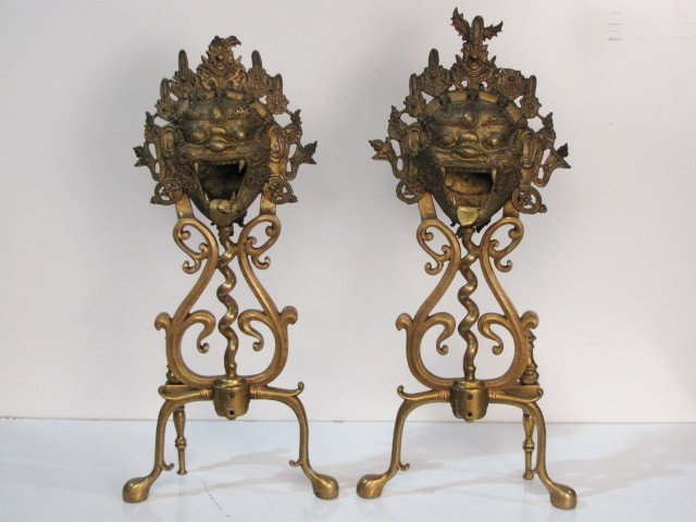 Pr. ASIAN FIGURAL BRONZE ANDIRONS: Damages to top of masks. 27" high.