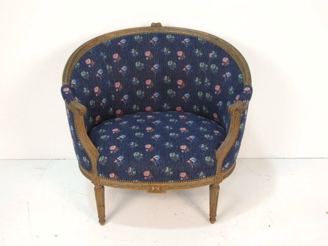 LOUIS XVI STYLE OVAL BERGERE: Finely carved. Distressed finish. Very good condition. 32 3/4"h. x 35 1/2"w. x 29"d.