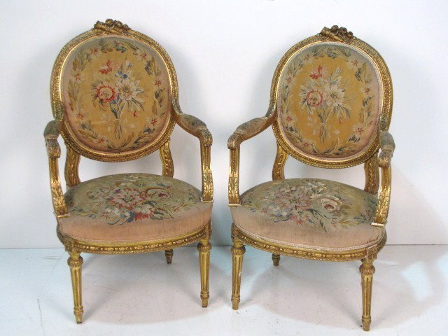Pair ANTIQUE FRENCH GILT AUBUSSON FAUTEUILS: Finely carved gilt frames. Wear to gilt. Some damage and wear to aubusson seats. 39 3/4"h. x 23 1/4"w. x 24"d.