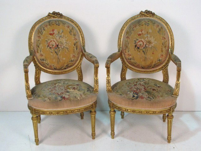 Pair ANTIQUE FRENCH GILT AUBUSSON FAUTEUILS: Finely carved gilt frames. Wear to gilt. Some damage and wear to aubusson seats. 39 3/4"h. x 23 1/4"w. x 24"d.