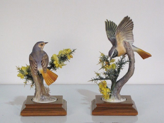 2 ROYAL WORCESTER DOROTHY DOUGHTY REDSTART BIRDS: Very good condition with a few broken needles. Largest measures 11"h. including base. Smallest measures 7 1/2"h.including base.