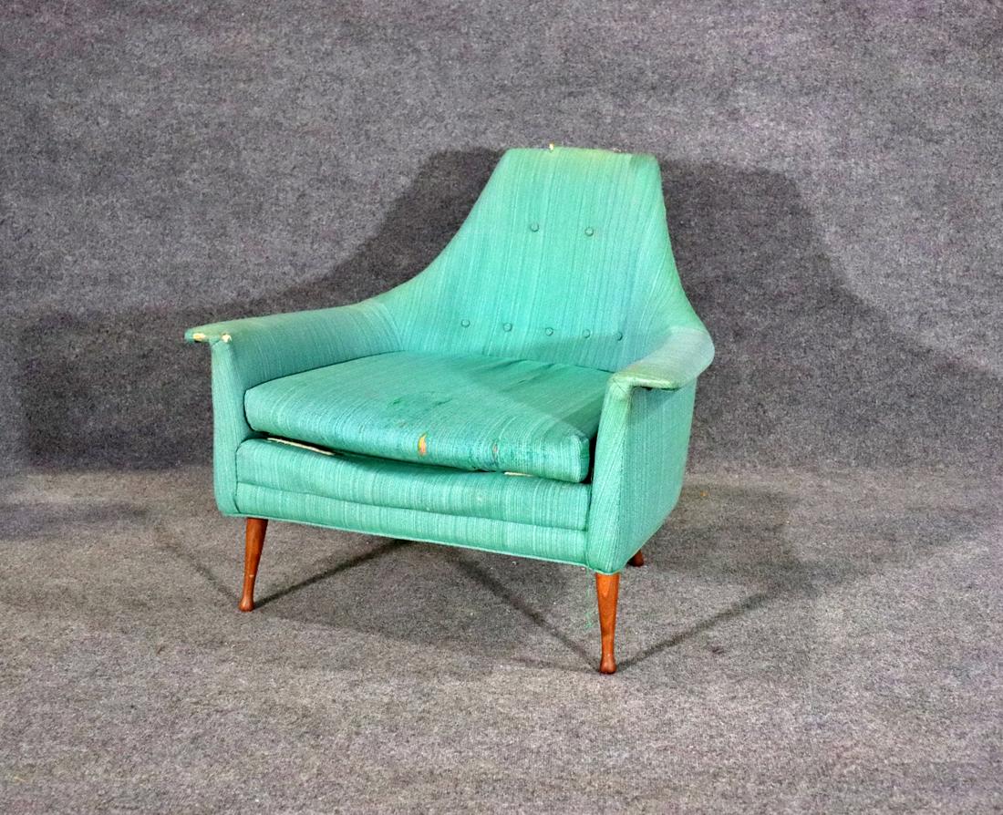 MID CENTURY MODERN LOUNGE CHAIR: Upholstered. Wood legs. 29 1/2" h x 35" w x 32 3/4" d. Seat height 15 1/2".