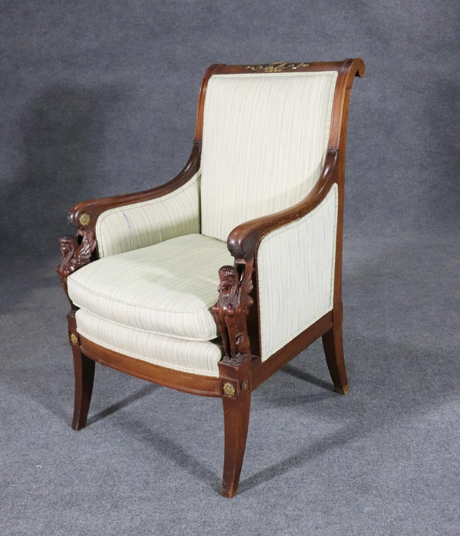 19TH C FRENCH EMPIRE FIGURAL BERGERE: Carved. Figural. Wood frame. Upholstered. Brass accents. 39 3/4" h x 26 1/4" w x 26 3/4" d. Seat height 19 1/2".