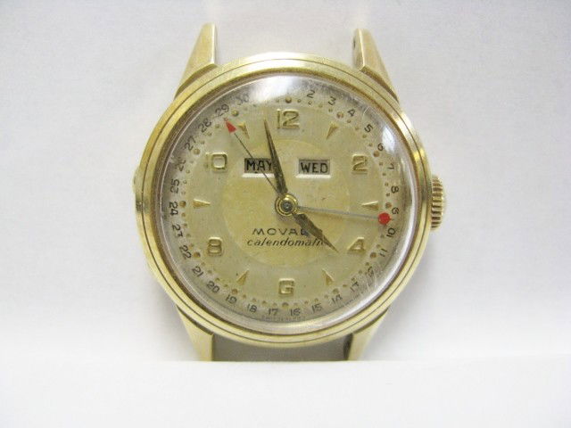 MOVADO CALENDOMATIC 14k GOLD WRIST WATCH: No band. Not presently running. Good condition.