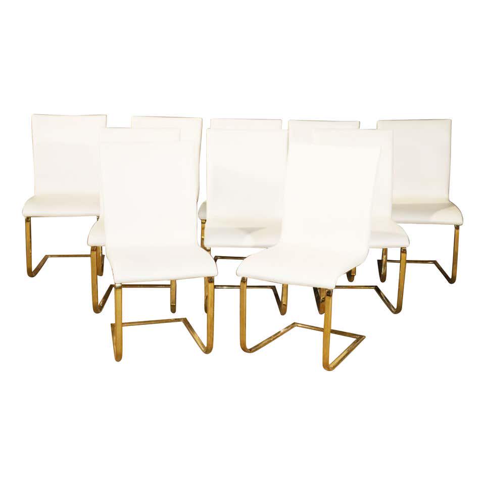 10 POST MODERN BRASS & WHITE UPHOLSTERED DINING CHAIRS (1 of 9)