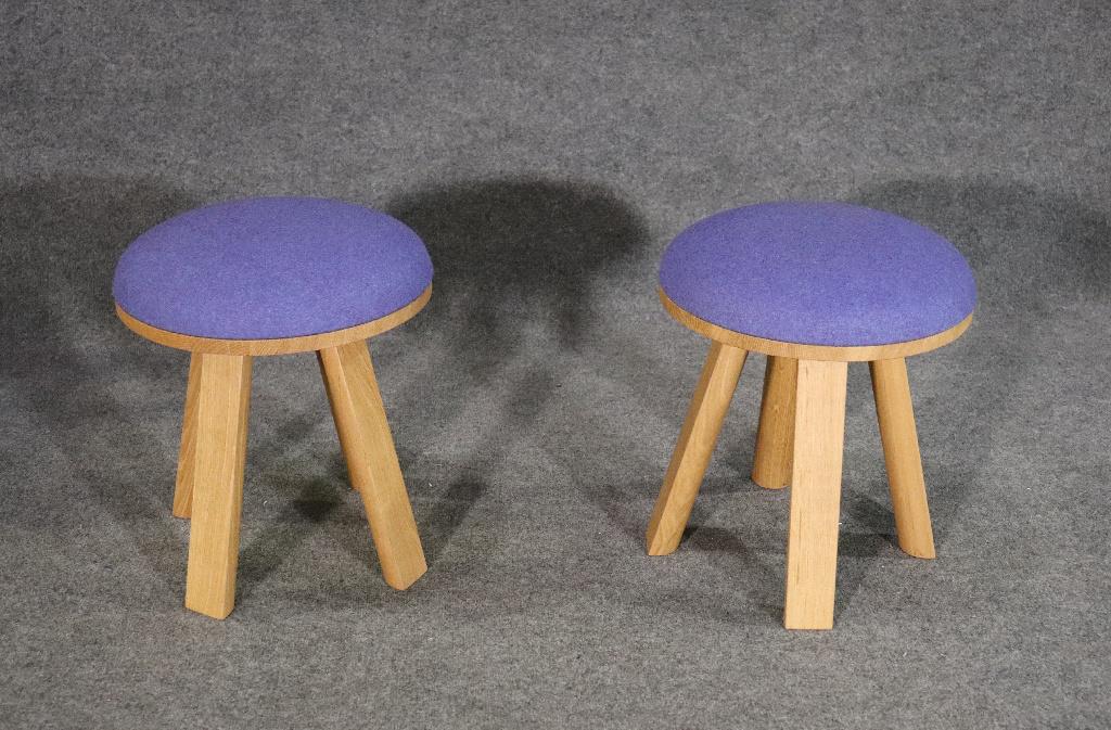PAIR BUZZI SPACE OTTOMANS: Wood frames. Upholstered seats. 18 1/4" h x 16 1/2" diameter.