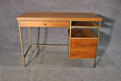 PAUL MCCOBB STYLE DESK: Walnut. Plated frame. 1 drawer on left. 1 file cabinet drawer on right. 1 shelf on right above filing cabinet drawer. 30 1/4" h x 44 x 20 1/8" d.