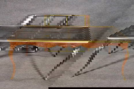 BERNHARD ROHNE FOR MASTERCRAFT BURL WALNUT & SMOKED GLASS TOP DINING TABLE: Burl walnut. Brass accents. 8 beveled smoked glass inserts on top. 4 beveled smoked glass inserts on leaf. 29 3/4" h x 82 1/2" w x 46" d. 1 - 45 5/8" leaf.