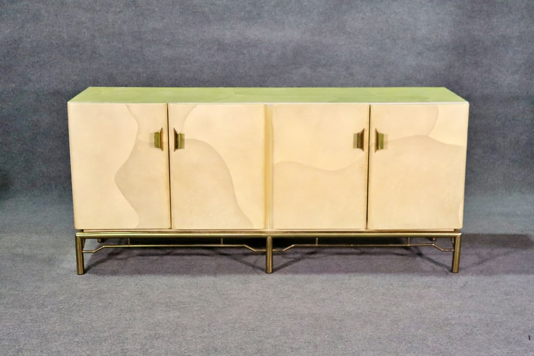 INLAID LACQUERED & BRASS SIDEBOARD ATTRIBUTED ENRIQUE GARCEL: Inlaid. Brass base and hardware. Lacquered. 4 doors containing 1 drawer and 1 shelf on each side. 32 3/4" h x 72 1/2" w x 23" d.