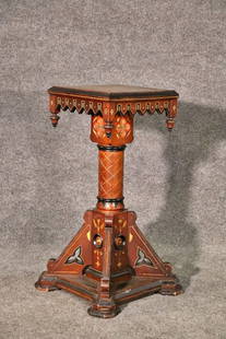 VICTORIAN CARVED PEDESTAL: Carved walnut. Ebonized accents. 39" h x 16 1/4" w x 16 1/4" d.