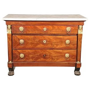 FRENCH EMPIRE STYLE FLAME MAHOGANY MARBLE TOP COMMODE: Circa 1880's. Marble top. Flame mahogany. Brass figural accents. Claw foot. 3 drawers. 34" h x 46" w x 21 1/2" d.