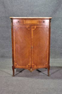 LOUIS XV STYLE INLAID MARBLE TOP DRESSER: Inlaid. Marble top. 1 dovetailed drawer on top. 2 doors containing 5 dovetailed drawers. Brass hardware and accents. 53" h x 36 3/8" w x 22 1/2" d.