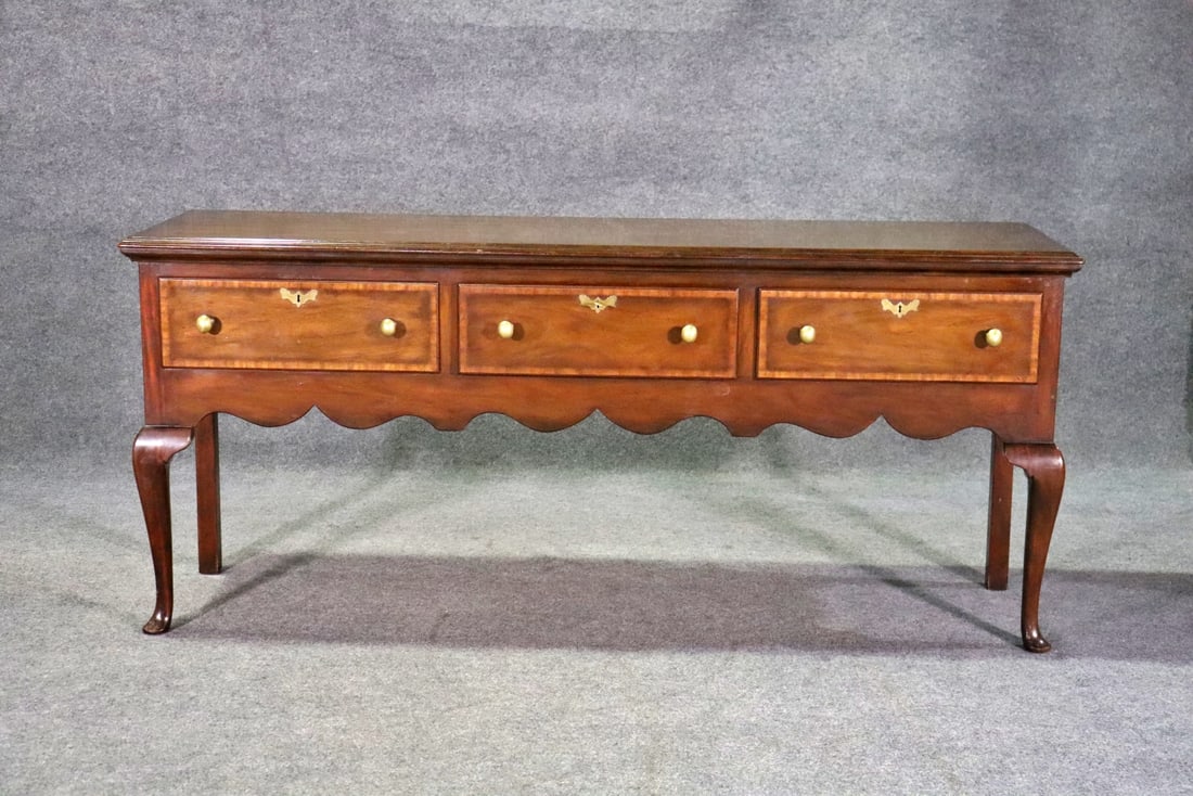 KITTENGER MAHOGANY 3 DRAWER SIDEBOARD: Mahogany. 3 dovetailed drawers. Brass hardware. Banded. 34" h x 74 3/8" w x 22 1/4" d.