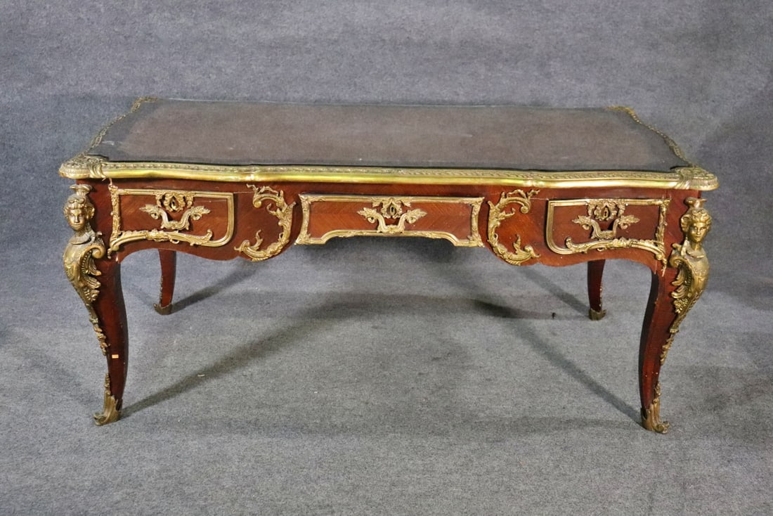 LOUIS XV STYLE BUREAU PLAT: Bronze mounted. 3 drawers. Leather top. Removable glass top. 3 faux drawers in back. 31 1/8" h x 71" w x 38 1/2" d.