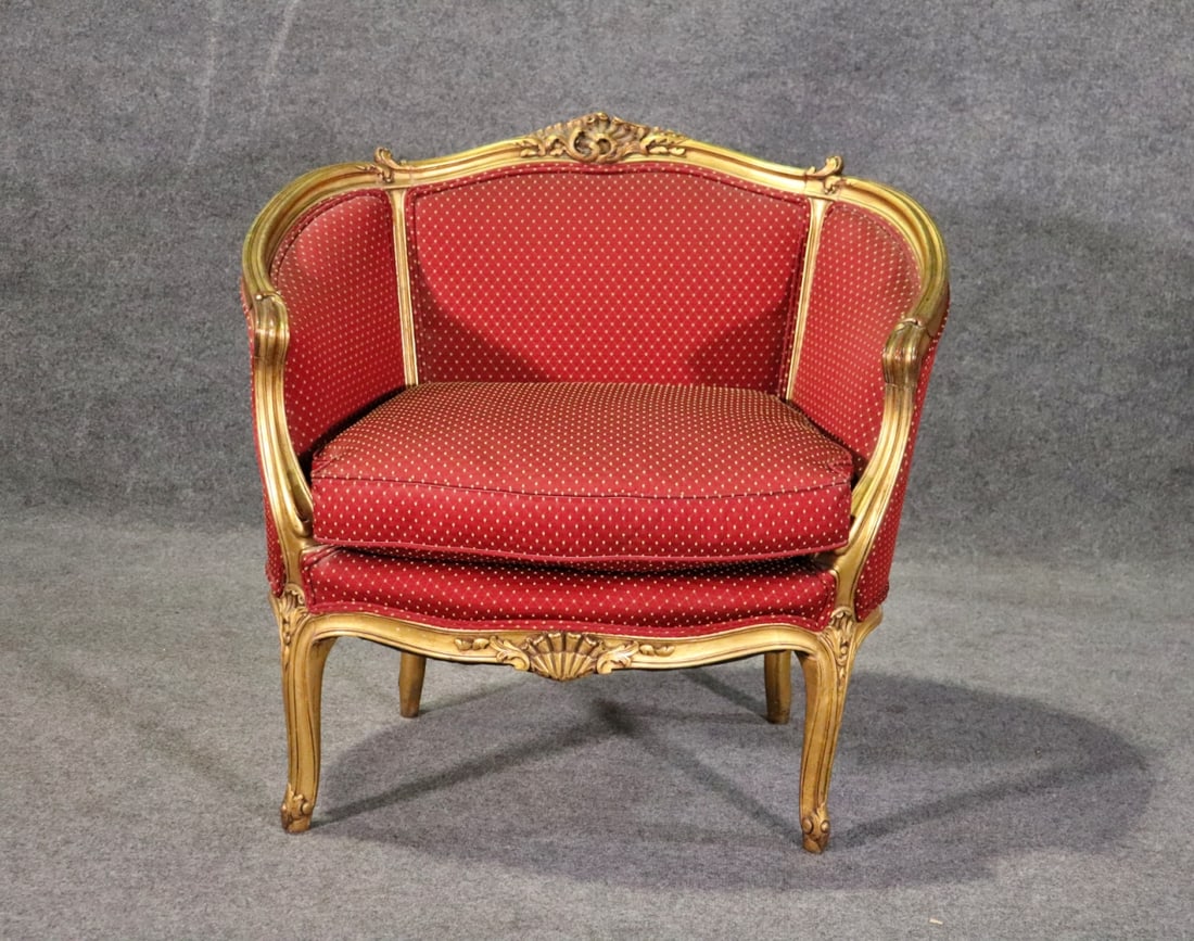 LOUIS XV STYLE CARVED FRENCH MARQUIS: Carved gilt frame. Upholstered. 33" h x 34 1/8" w x 27 3/4" d. Seat height 19 1/2".