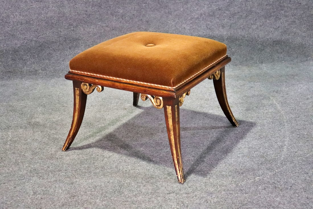 MAHOGANY EMPIRE STYLE OTTOMAN: Mahogany frame with gilt accents. Upholstered seat. 20 1/2" h x 27" w x 26 1/2" d.