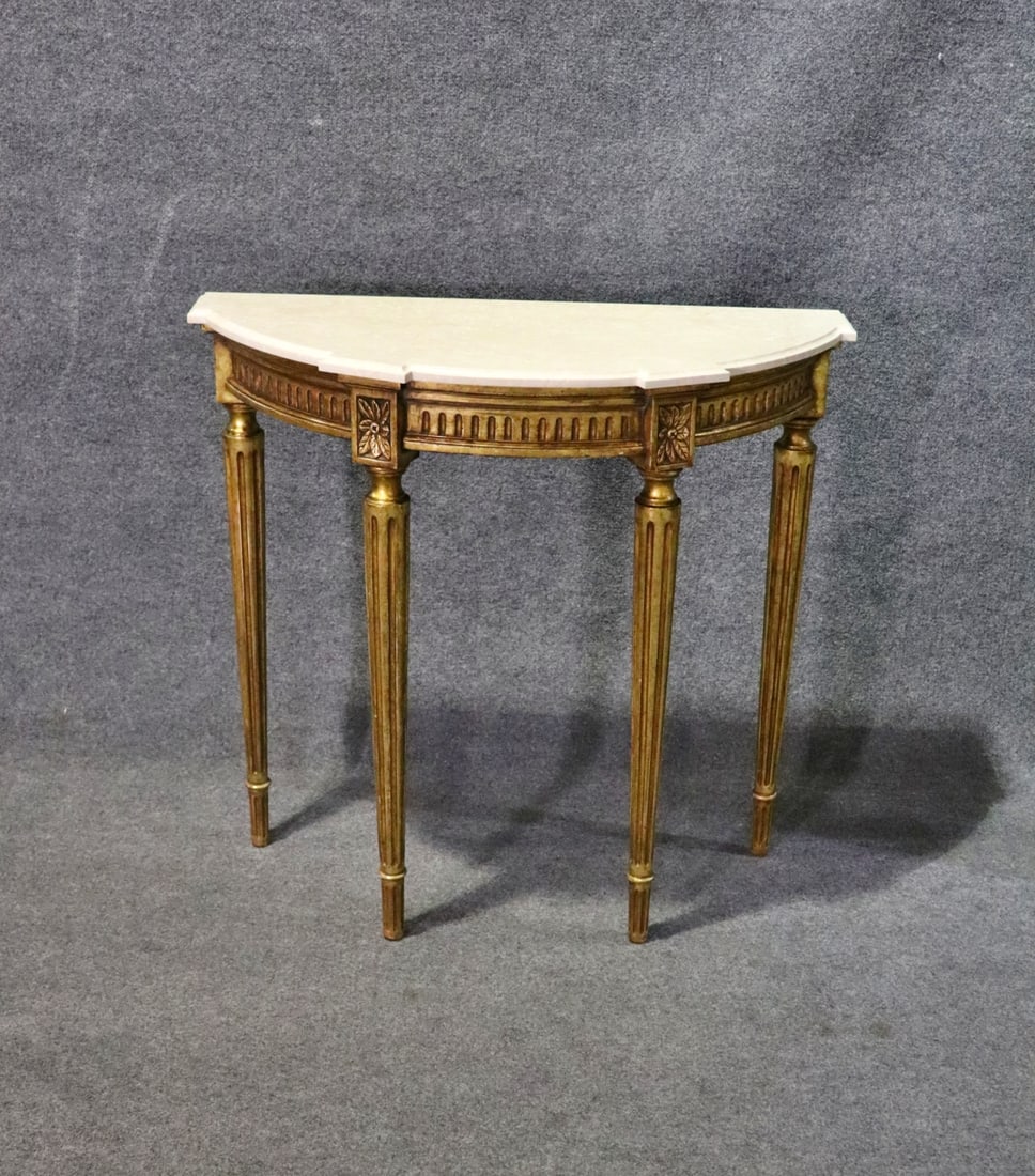 LOUIS XVI STYLE MARBLE TOP DEMILUNE CONSOLE: Carved gilt frame. Marble top. 34 1/8" h x 36 1/4" w x 15 3/4" d.