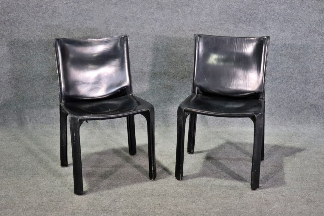 PAIR CASSINA ITALIAN #412 CAB SIDE CHAIRS: Leather cover. 32" h x 18 3/4" w x 18 1/2" d. Seat height 17 1/2".
