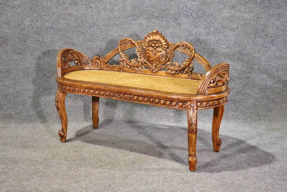 FURNITURE CLASSICS CANE BENCH: Carved wood. Cane. 31" h x 50" w x 20" d. Seat height 18 1/4".