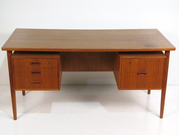 SCANDINAVIAN MODERN TEAK DESK: Good condition. Some wear to top. 29"h. x 59 1/4"w. x 27 3/4".