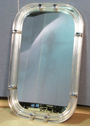 LES PRISMATIQUES LUCITE FRAMED MIRROR: Very good condition. 50 1/4" x 30 3/4". Part of a collection of mirrored furniture from a Long Island estate.