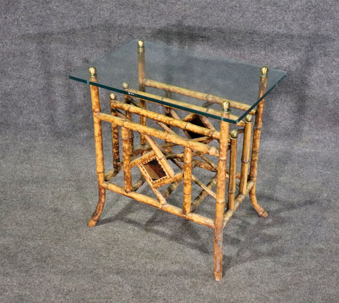 BAMBOO GLASS TOP MAGAZINE RACK: Bamboo base. Glass top. Brass accents. 26" h x 24 1/8" w x 15 1/8" d.