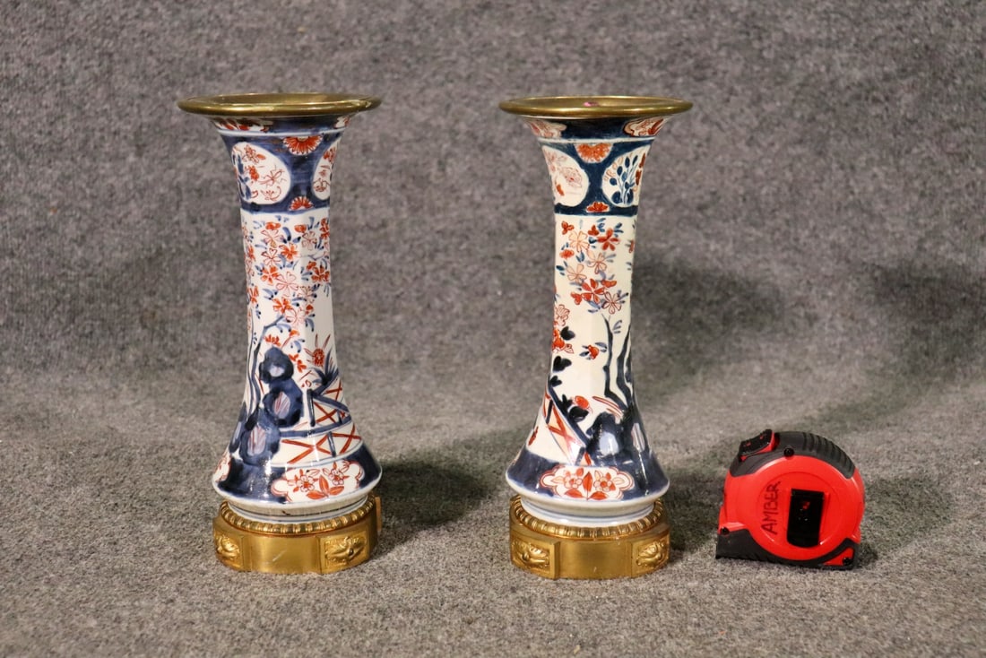PAIR JAPANESE IMARI PORCELAIN CANDELABRAS: Bronze mounted. Porcelain. 11 1/8" h x 4 3/4" diameter.