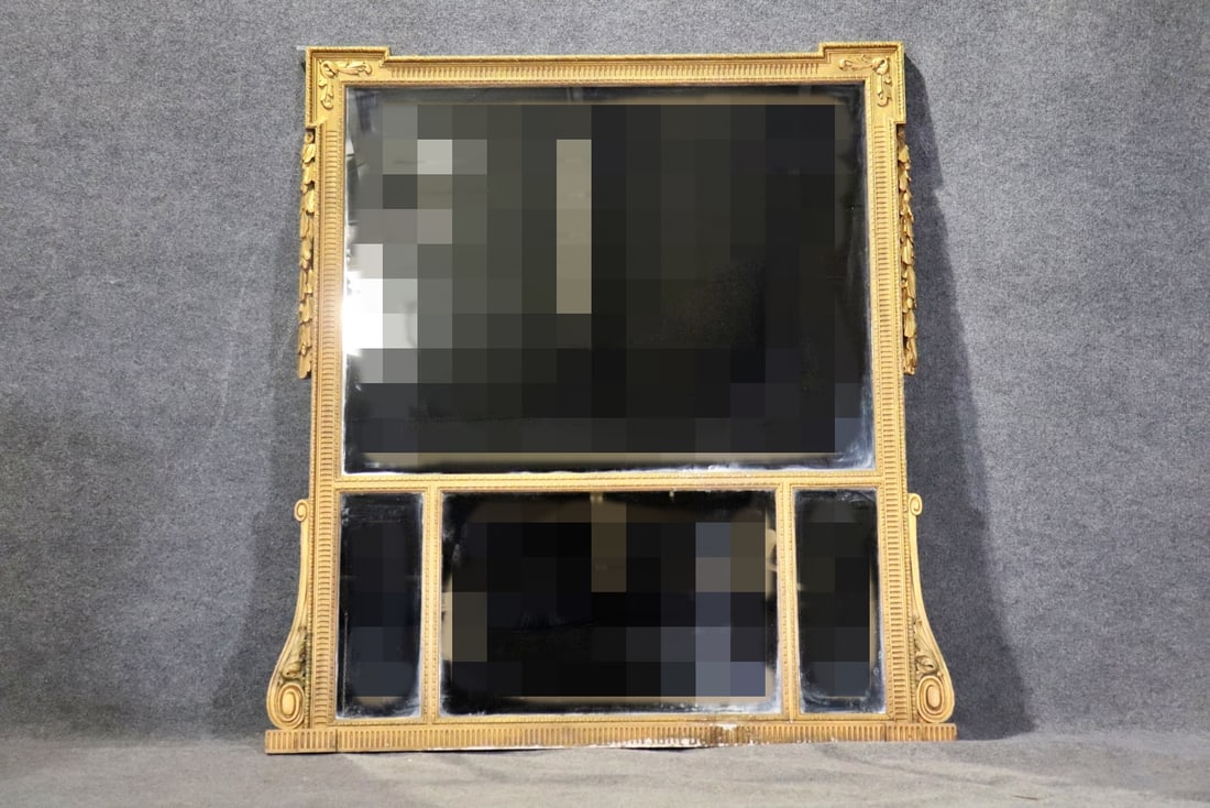 CARVED GILT WOOD MIRROR: Framed measures 60 3/4" h x 56 3/8" w x 2 1/2" d.