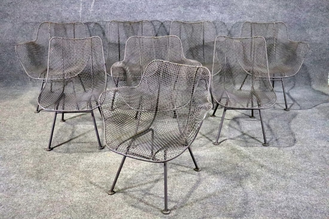 8 RUSSELL WOODARD SCULPTURA CHAIRS: Metal. Painted. 4 arm chairs measure 28 3/8" h x 26 1/2" w x 24" d. Seat height 13 1/2". 4 side chairs measure 28 1/4" h x 19" w x 23 1/4" d. Seat height 13 1/2".